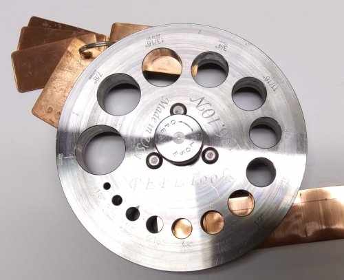 Judy Larson's Disc Cutter Basics and How to Make Metal Washers - Directions:, General Education, Tools, : Position the metal in the cutter